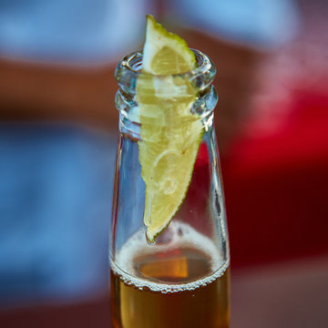 Ice Cold Beer In A Bottle With Wedge Lime