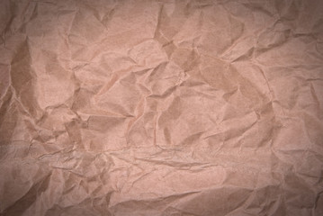 Fototapeta premium crumpled brown paper background or texture