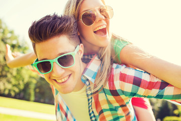 smiling couple having fun in park