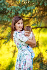 Mother with baby son, close-up, summer