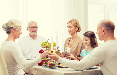 smiling family having holiday dinner at home