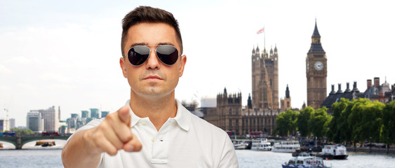man in sunglasses pointing finger on you