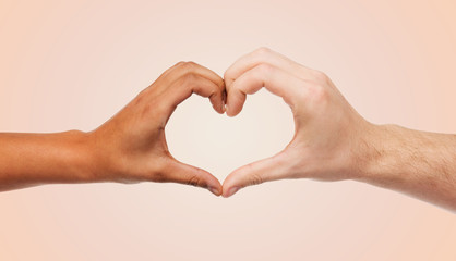 woman and man hands showing heart shape
