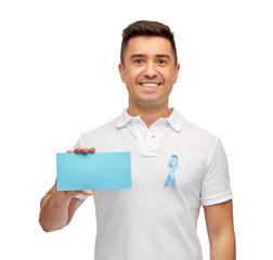 man with prostate cancer awareness ribbon and card