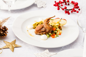 quail with salad on Christmas table