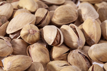 background of dried pistachios close up