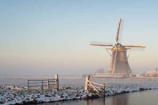 Winter landscape in the Netherlands with a windmill