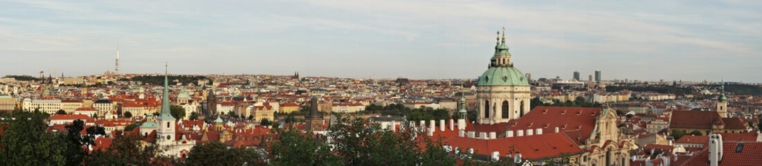 Obraz premium St. Nicholas Church and Charles Bridge viewed from Prague Castle (Czech Republic).