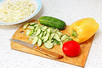 Fresh vegetable on wooden cutting board.