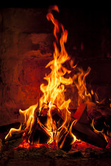 Fireplace with a blazing flames.