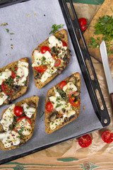 delicious bruschetta with tomatoes, cheese and mushrooms