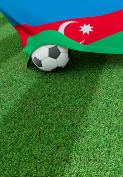 Soccer ball and national flag of Azerbaijan,  green grass