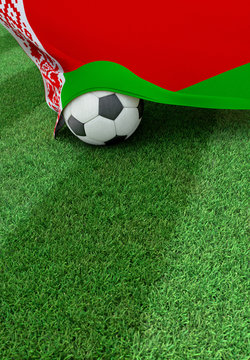 Soccer ball and national flag of Belarus,  green grass