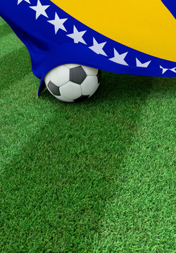 Soccer ball and national flag of Bosnia and Herzegovina,  green grass