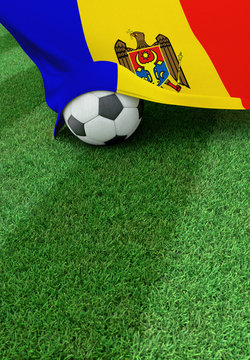 Soccer ball and national flag of Moldova,  green grass