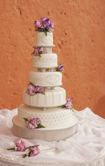 White wedding cake decorated with flowers