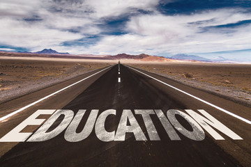 Education written on desert road