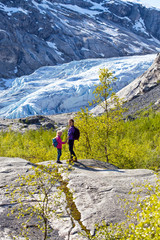 girls against the backdrop of a glacier