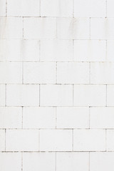 Texture and seamless background of white granite stone wall