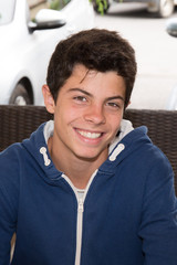Portait of a young man teenager boy smiling