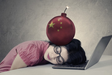 Businesswoman with chinese flag on the bomb