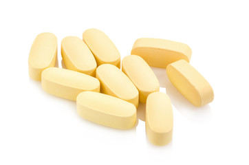 vitamin pills on white background