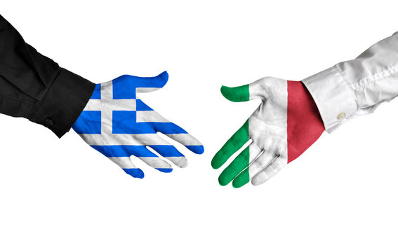 Greece and Italy leaders shaking hands on a deal agreement