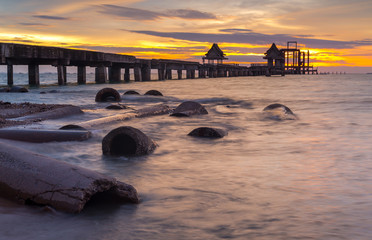 Wooded bridge in the port and sunset