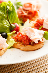 Bruschetta with tomato and ham