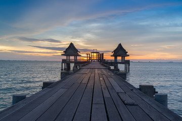 Wooded bridge in the port and sunset