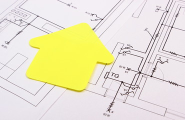 House of yellow paper on construction drawing, concept of building home