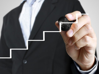 Business man hand drawing  graph