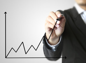 Business man hand drawing  graph