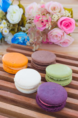 Colorful French Macarons On wood panel