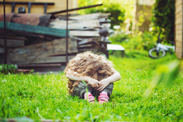 Sad little girl on outdoors.