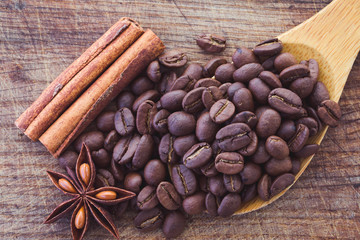 coffee beans, anise and cinnamon on table