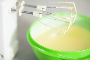 Tiramisu ingredients concept. Mixed egg yolks with sugar