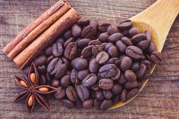 coffee beans, anise and cinnamon on table