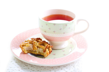 Mini tart and cup of tea