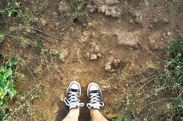 Wearing black canvas shoes