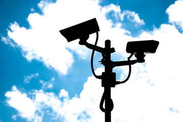 Silhouettes CCTV cameras.