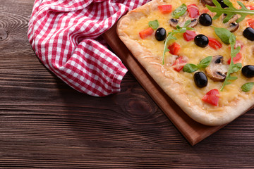 Delicious homemade pizza on table close-up