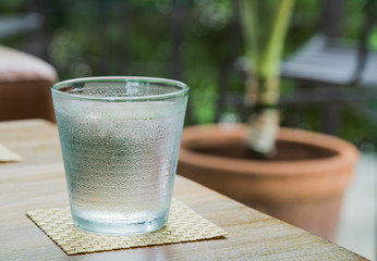 Water in a glass with ice.