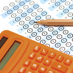 answer sheet test score with pencil calculator