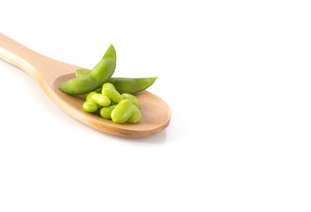 Green soya , Wooden spoon on white background.