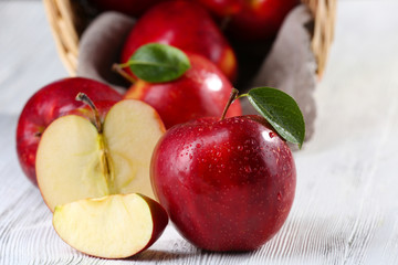 Ripe red apples on table close up