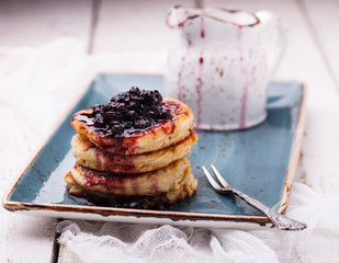 Cottage cheese pancakes with blueberry jam.selective focus