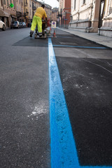 Asphalt marking paint with spray applicator thermoplastic machine during the reconstruction works of the road