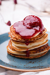 Cottage cheese pancakes with raspberry jam.selective focus..