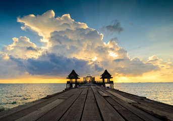 Wooded bridge in the port and sunset